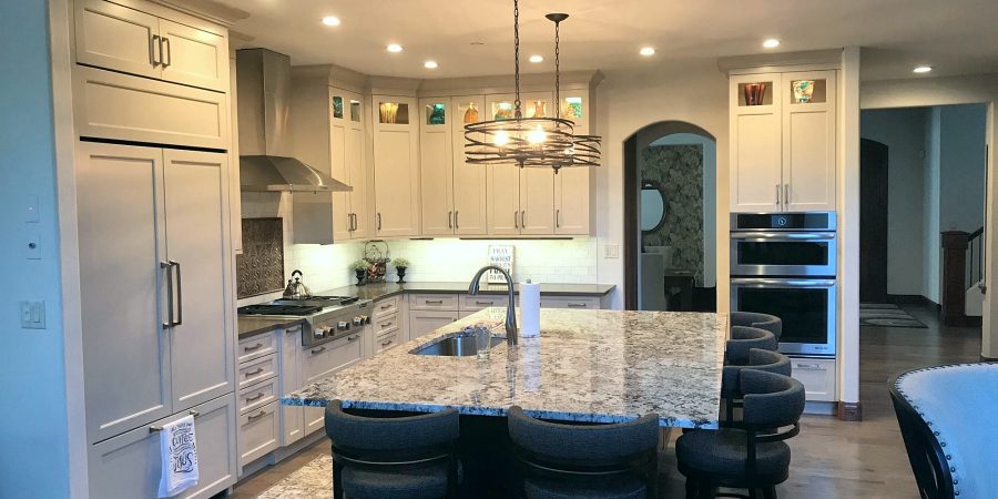 Cream shaker kitchen with a dark stone-top island