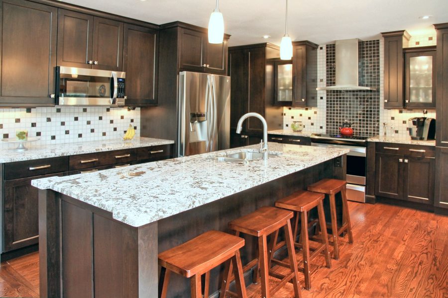 Espresso cabinets with light stone island