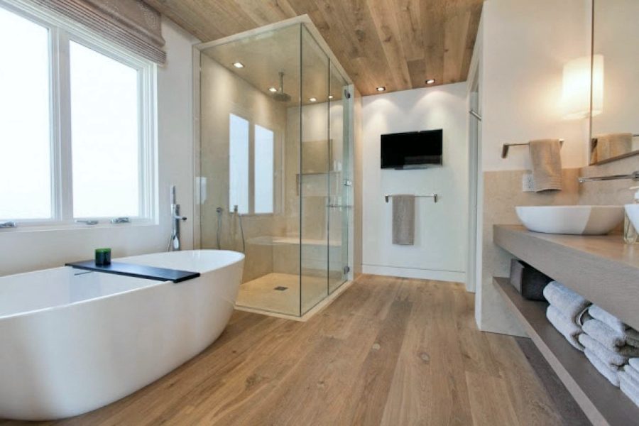 Bath with freestanding tub and wood-plank ceiling