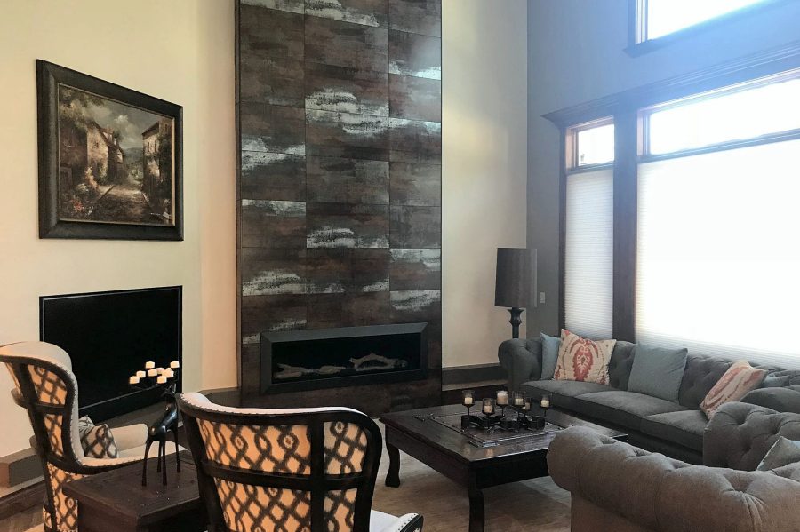 Floor-to-ceiling tile fireplace wall