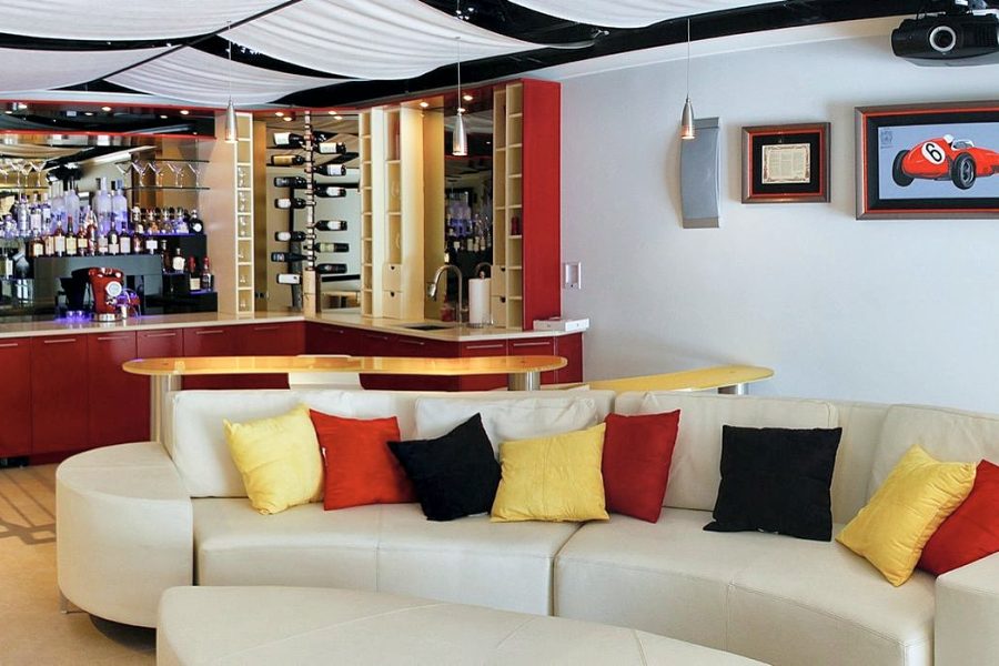 Basement lounge with glossy red wet bar