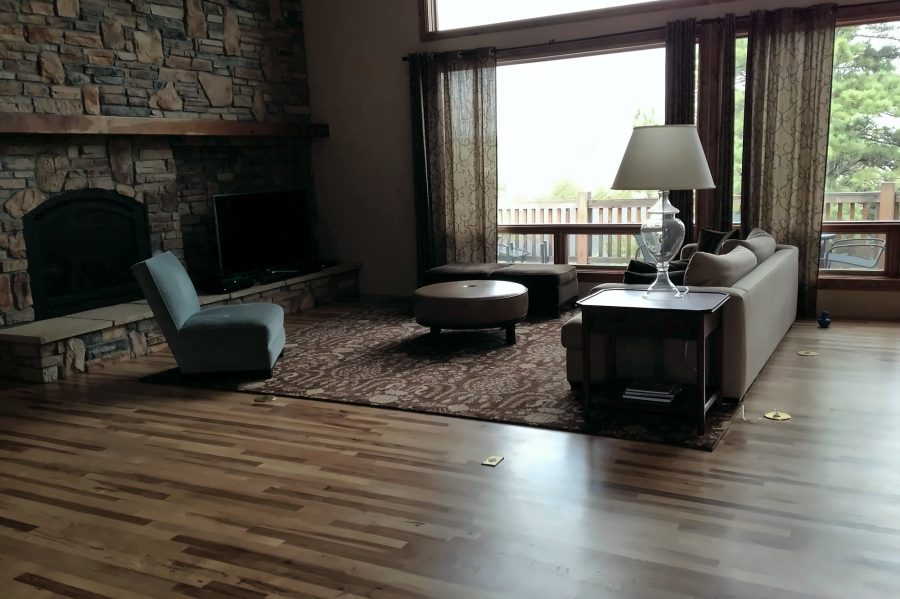 Two-story living room with stone fireplace